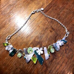 Ikita (Paris) marked silver tone necklace, poured glass over foil